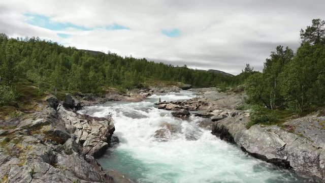 Beautiful wild river called Otta in Norway.
Filmed with drone, flown from right to left side.