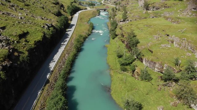 A road that was shot from above in Norway.
The road is near the city Skei.
Drone flies backwards and filmes up.
