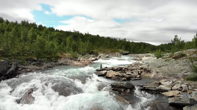 Beautiful wild river called Otta in Norway.
Filmed with drone, fly over.