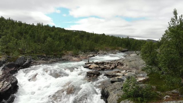 Beautiful wild river called Otta in Norway.
Filmed with drone, fly over.
Stones stacked on a stone.