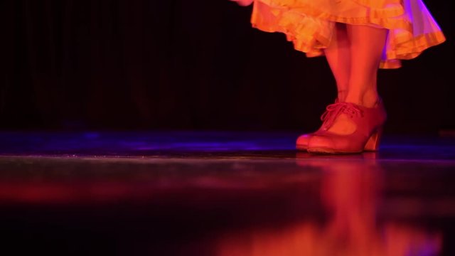 flamenco dancer stomping and dancing on a stage