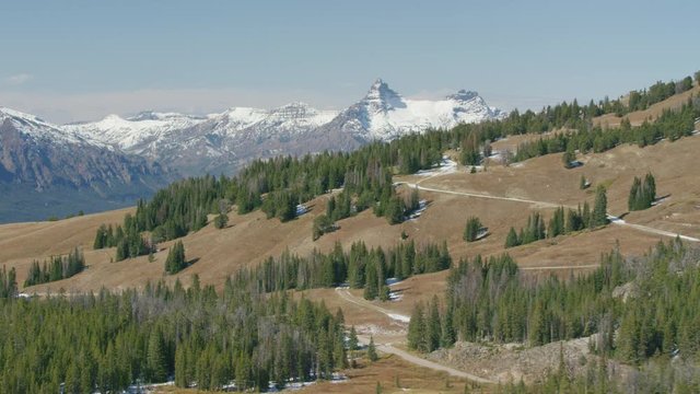 A high mountain lake sits in the shadow of Pilot Peak (left) and Index Peak (right), in the heart of the Beartooth mountain range near Yellowstone National Park