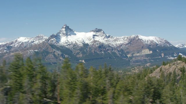 A high mountain lake sits in the shadow of Pilot Peak (left) and Index Peak (right), in the heart of the Beartooth mountain range near Yellowstone National Park