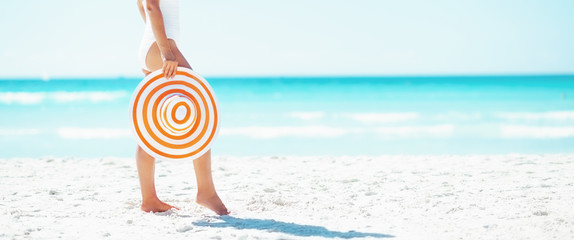 young woman with hat on beach