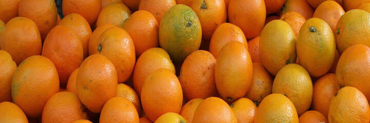 horizontal background with many orange oranges