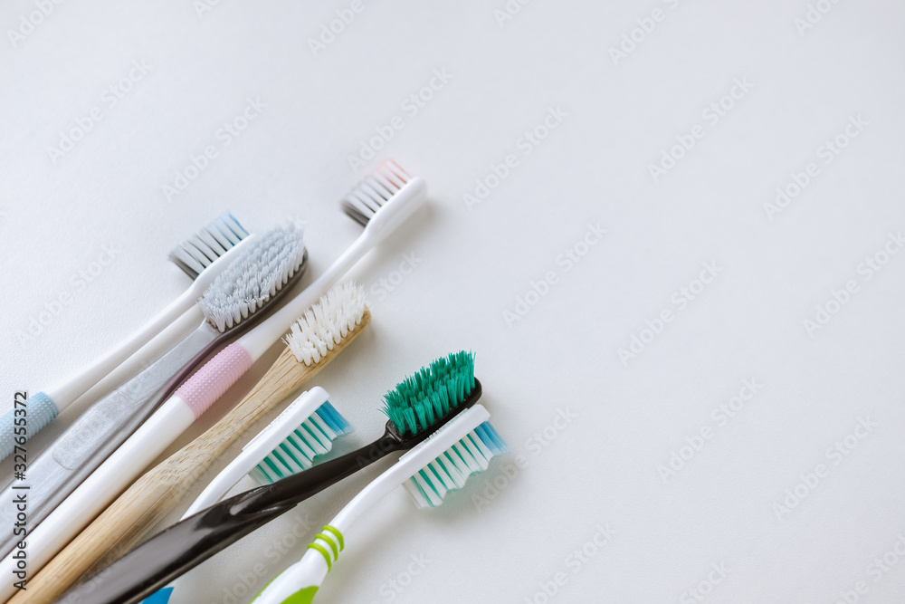 Wall mural different types of toothbrushes on a white background with copy space. dental care concept