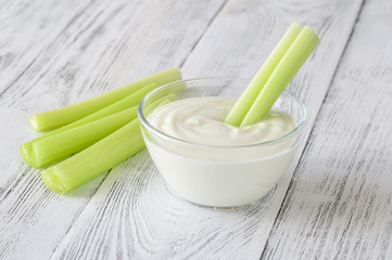 Celery stalk dipped in yogurt
