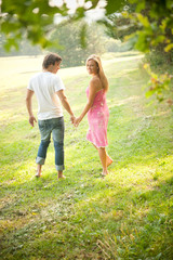 Fototapeta premium Happy young couple in love enjoying a summer day