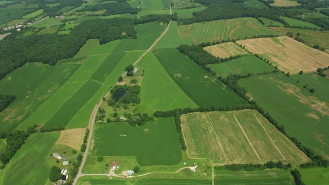 Indiana circa-2019.  Aerial view of rural Indiana farmlands.  Shot from helicopter with Cineflex gimbal and RED 8K camera.