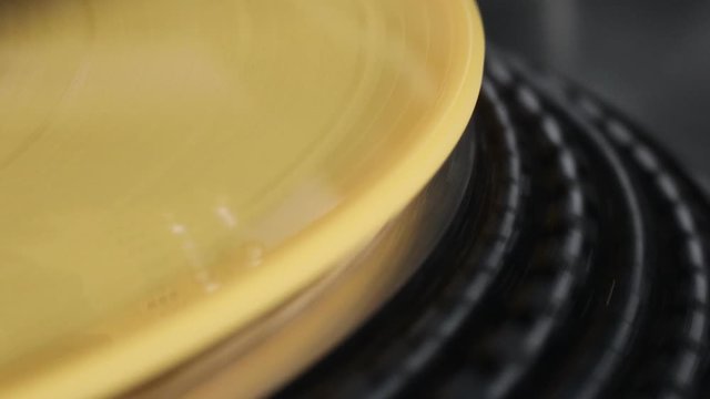 Yellow vinyl record playing macro close up