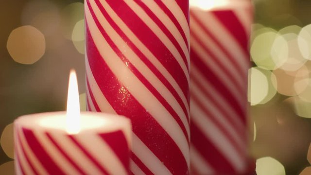 Christmas candles with red and white stripes.