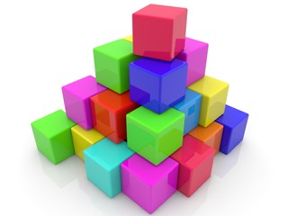 Obraz premium Colored toy blocks stacked in a pyramid shape on a white background