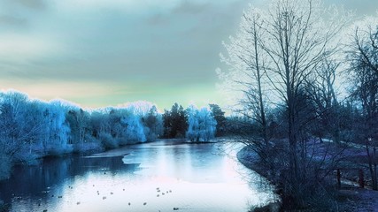 Frozen lake in german park in winter 