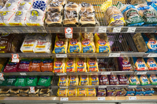 Gold Coast, Australia - May 09 2018: Sliced bread and toast from various brands such as tiptop and Multicafe are displayed in a supermarket.