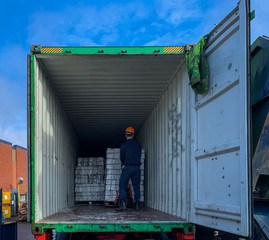 loading a shipping container with baled aluminium