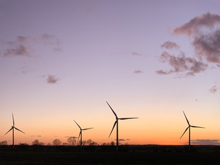 Wind turbines at sunset