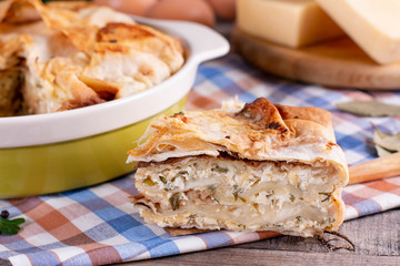 Savory puff pastry, spanakopita, Greek pie with cheese filling