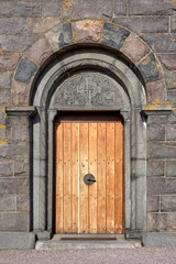 Fototapeta na wymiar Wooden door of Gudhjem church, Bornholm island, Denmark.
