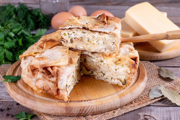 Homemade pie with cheese and herbs