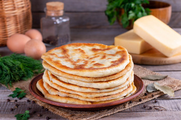 Frying flatbread filled with cheese