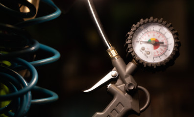 Fototapeta premium Pressure gauge close up in workshop. Selective focus.