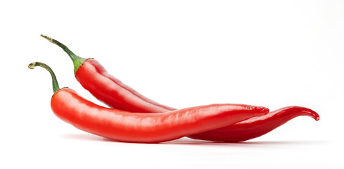 Red hot chilli peppers isolated on white background.