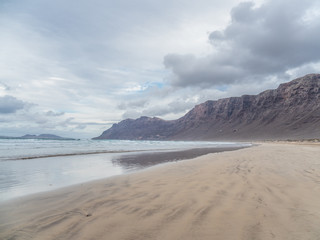 Fototapeta na wymiar Beach Caleta de Famara on island Lanzarote.