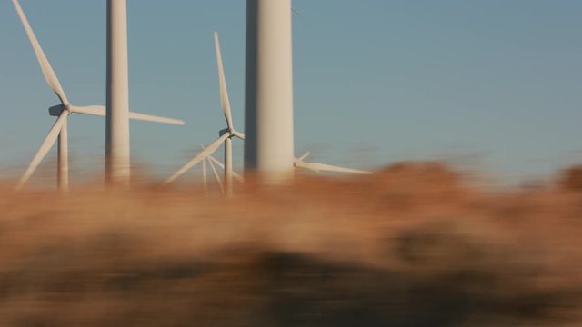 Tracking shot of energy producing wind turbines in Oregon. 