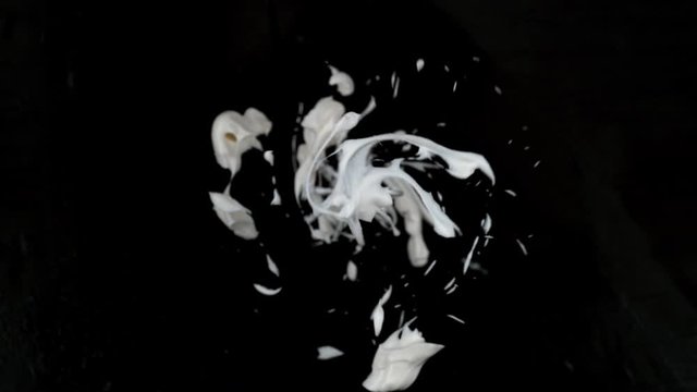 Cake batter spinning off whisk in super slow motion.  Shot with Phantom Flex 4K camera.