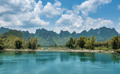 Cao Bang / Guangxi, Vietnam and China landscape.  Emerald green river stream of Song Quay Son river, border of Northern Vietnam and China. Close to Ban Gioc and Detian waterfall. 