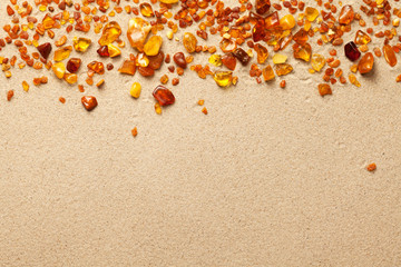 Ambers On Sand Background