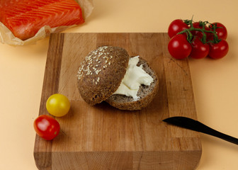 Keto bread made from almond flour and psyllium with cream cheese and a slice of salmon. Paleo and intermittent fasting diet.