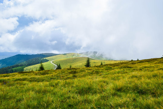 Fog and low clouds over the Transalpina serpentines road DN67C. This is one of the most beautiful alpine routes in Romania.