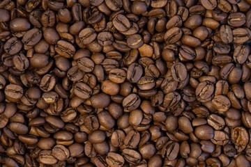 Big group of roasted coffee beans in detail