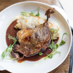 Crispy Duck Leg Confit with Potato Gratin and Red Wine Sauce
