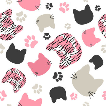 Seamless vector pattern with cats heads and tiger print for kids