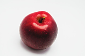 Ripe red red apple close-up isolate on a white background.
