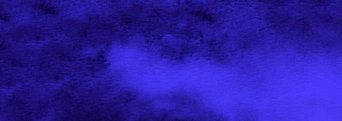 Abstract blue watercolor background. The color splashing on the paper. Hand drawn.