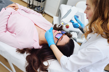 removal of tattoos, pigmentation, moles, vascular asterisks using a neodymium laser in a modern...