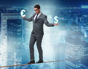 Businessman balancing between choosing dollar and euro