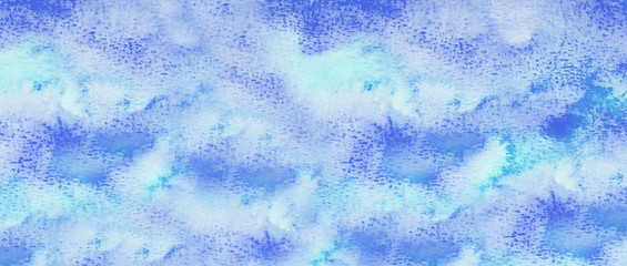 Abstract blue watercolor background. The color splashing on the paper. Hand drawn.