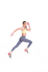 soft focus of Fit girl jumps running , smiling isolated on white