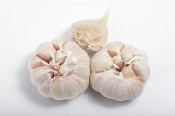 Close - up shot of garlic on a white isolated background