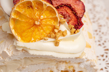 Juicy sliced meringue cake with dried fruits