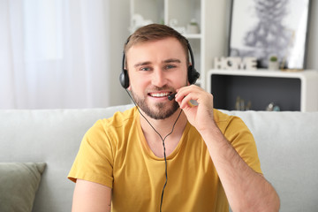 Young man using video chat at home