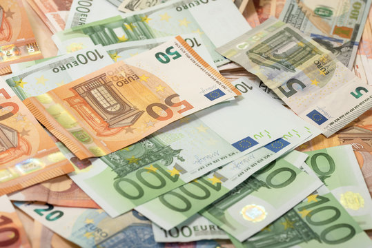 Background of dollar, euro banknotes on a table