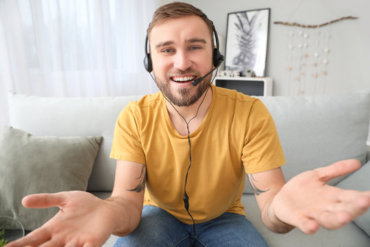 Young Man Using Video Chat At Home