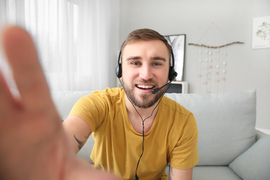 Young Man Using Video Chat At Home