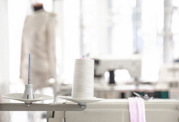 Spool of threads in tailor workshop