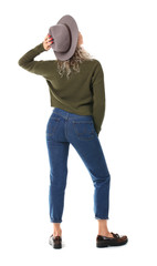 Naklejka premium Beautiful young woman in warm sweater on white background, back view